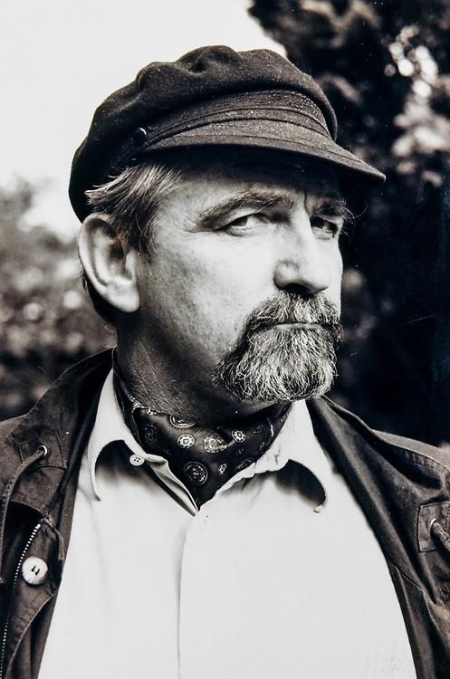 A younger Terry Bell, cap on, looking to the side